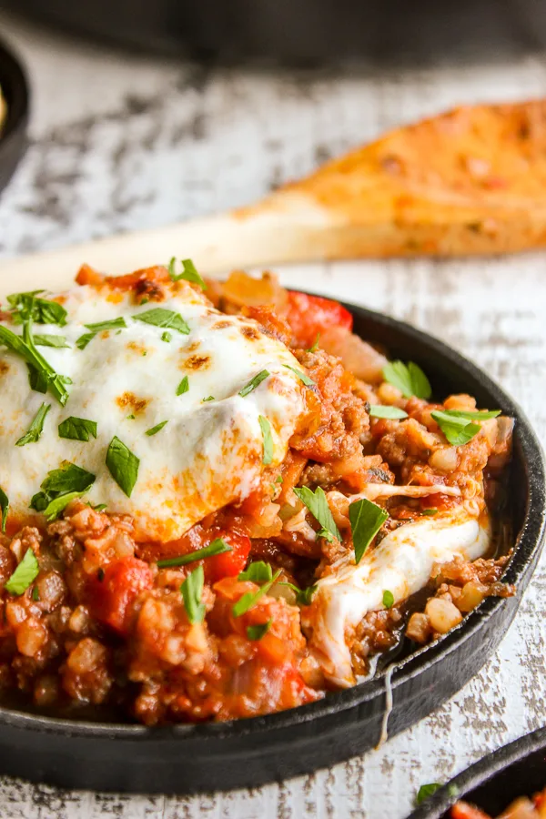 Italian stuffed pepper cauliflower rice skillet is a delicious twist on traditional stuffed peppers.  It's low carb, high protein and ready in 30 minutes, making it perfect for any night of the week.