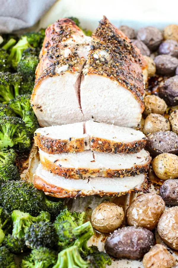 Close up of the Sheet Pan Dinner after it's done roasting with the pork sliced and ready to serve.