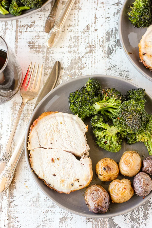 Overhead shot of Tuscan Pork Sheet Pan Dinner served on a dinner plate.