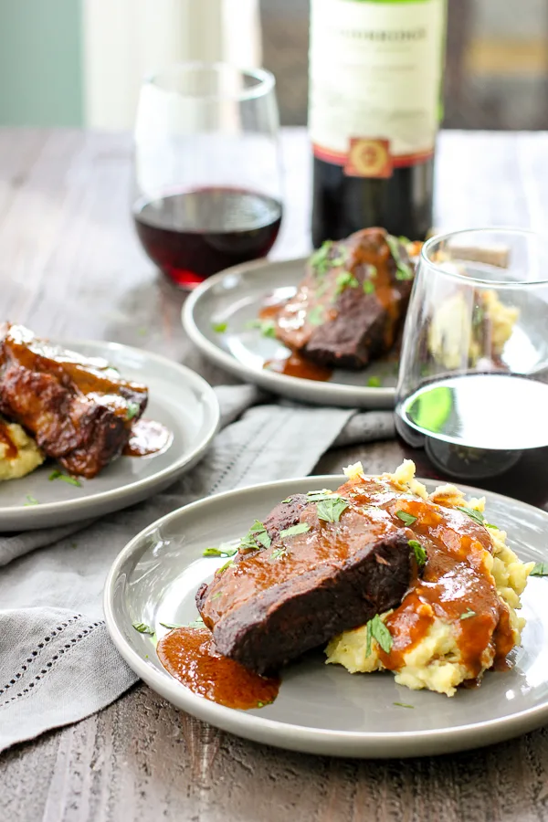 Cabernet braised short ribs plated with mashed potatoes and the cabernet sauce