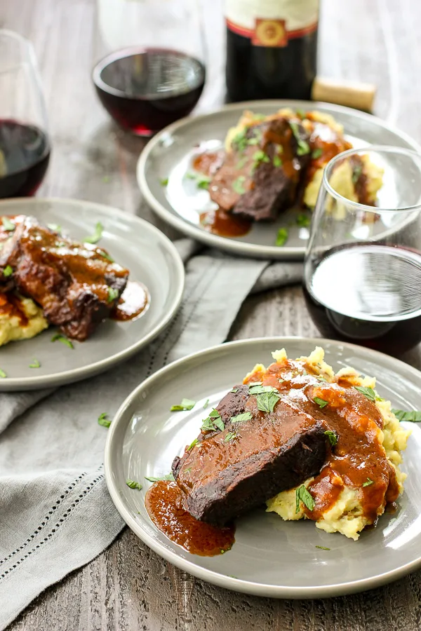 Cabernet short ribs plated, served with mashed potatoes red wine sauce and red wine