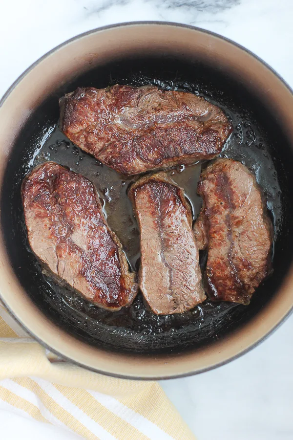 Sautéing the short ribs in a dutch oven