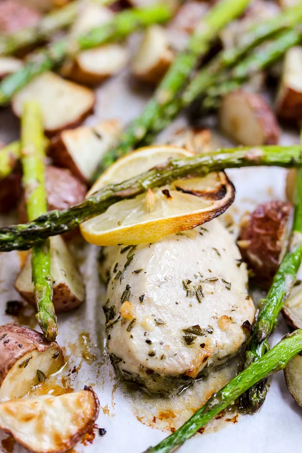 Close up photo of Lemon Rosemary Chicken and Veggie Sheet Pan Dinner after roasting