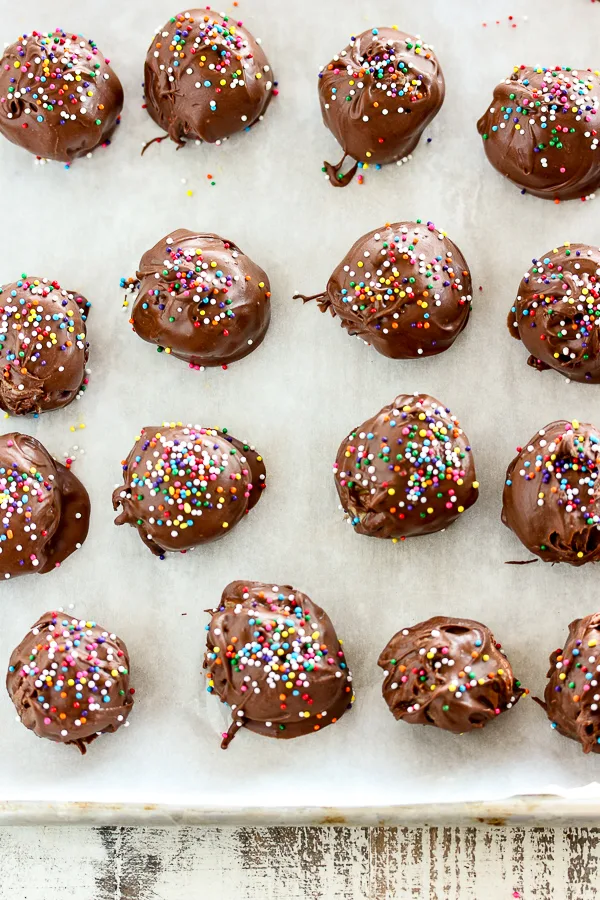 Overhead of cookie dough truffles on a sheet pan