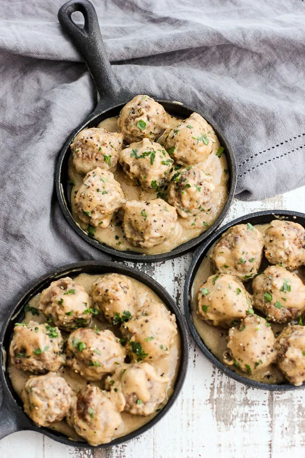 Meatballs in small skillets for serving.