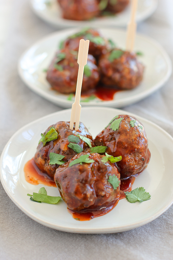 Baked meatballs tossed in BBQ sauce and plated.