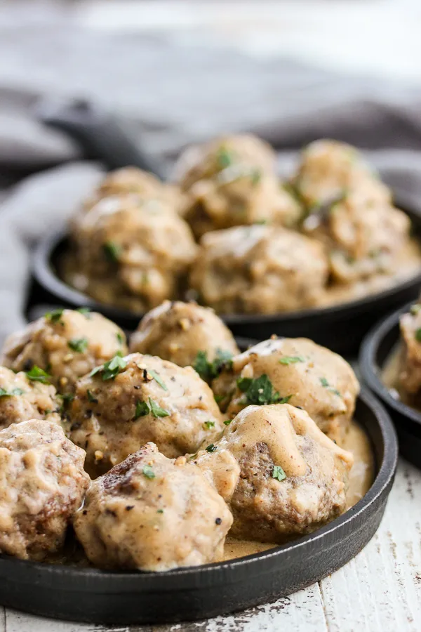 Swedish meatballs displayed in mini cast iron skillets