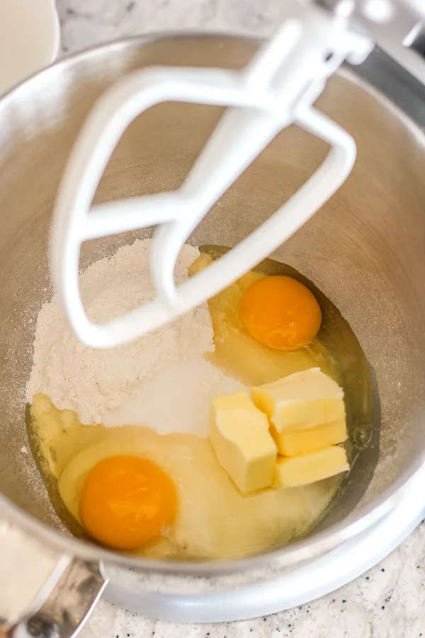 Eggs, flour and sugar in the mixing bowl before mixing