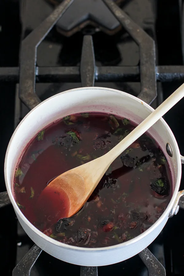 Process shot for the simple syrup after the blueberries have broken down