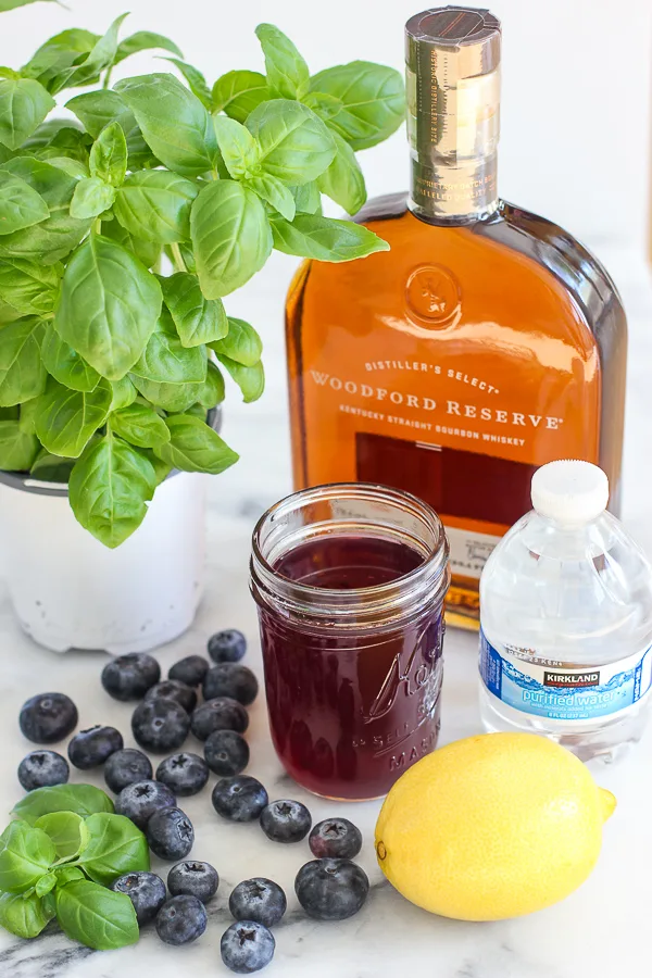 Ingredients needed to make the blueberry basil bourbon smash cocktail