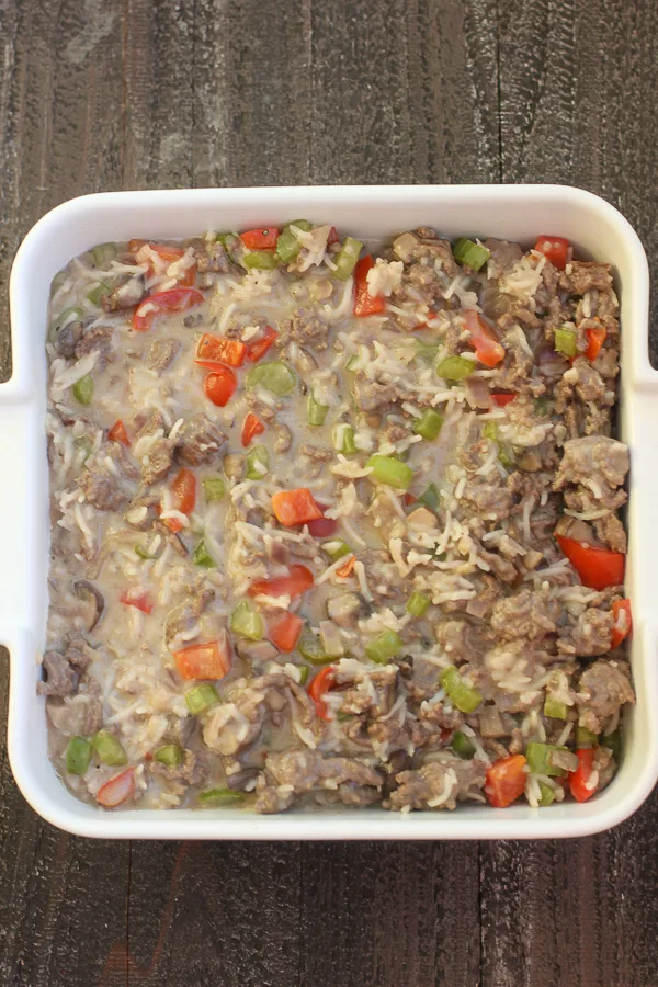 The chow mein casserole in the baking dish before topping with chow mein noodles and baking