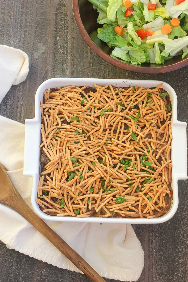 Overhead photo of the casserole in the baking dish after baking with a side salad