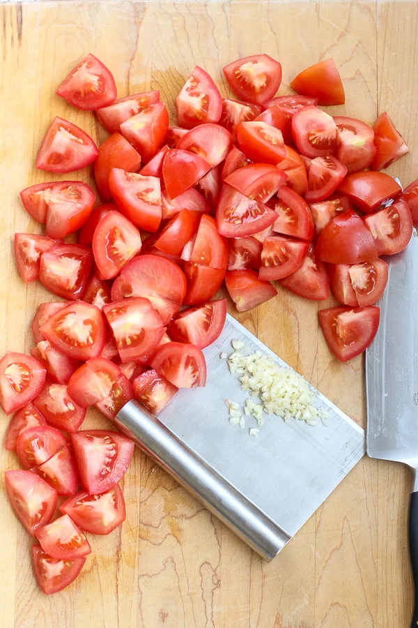 The tomatoes and fresh garlic after chopping